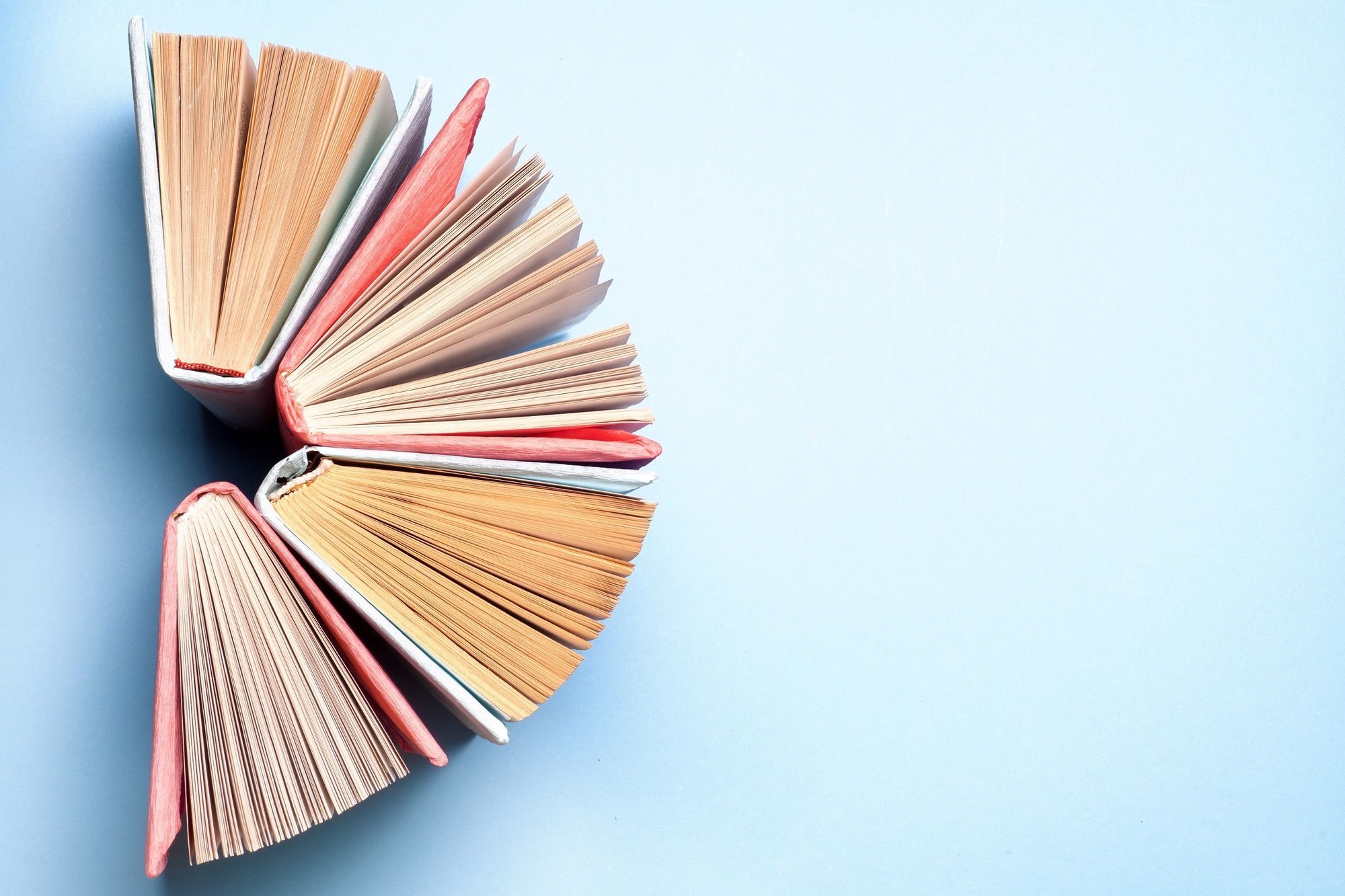 Top view of books standing in a semicircle